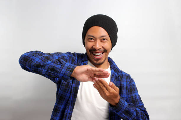 istock Asian man is making a SPEND MONEY gesture 1861596046