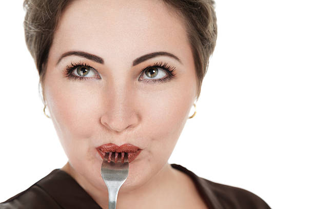istock Beautiful young woman with fork 186160338