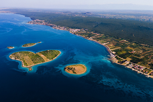 The heart-shaped island of Galešnjak, also known as the Island of Love or the Island of Lovers, is located in the Adriatic Sea near the town of Zadar in Croaria.