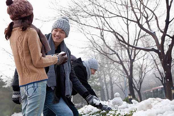 istock Friends Playing in the Snow 186161510