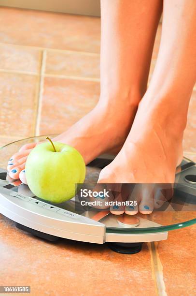 Woman Trying To Lose Weight Stock Photo - Download Image Now - Adult, Apple - Fruit, Bathroom