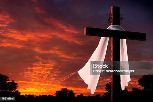Dramatic Lighting On Christian Easter Morning Cross At Sunrise Stock Photo - Download Image Now