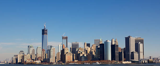 Manhattan Skyline in Fall Skyline of New York City at the Southern tip of Manhattan with the new World Trade Center under construction in Fall 2012. panoramic riverbank architecture construction site stock pictures, royalty-free photos & images