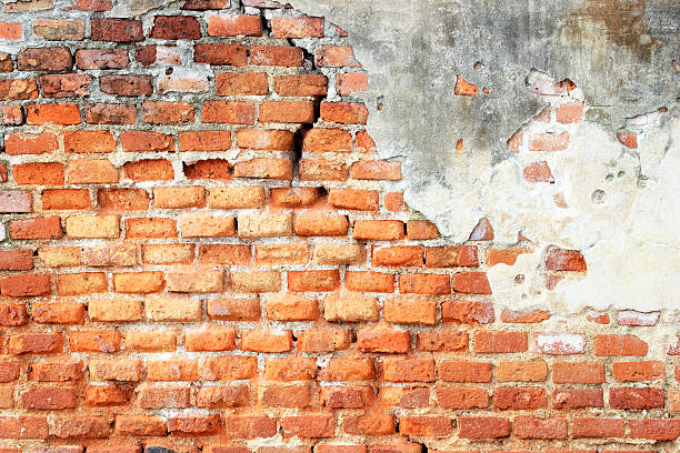 istock cracked concrete vintage brick wall background 186163909