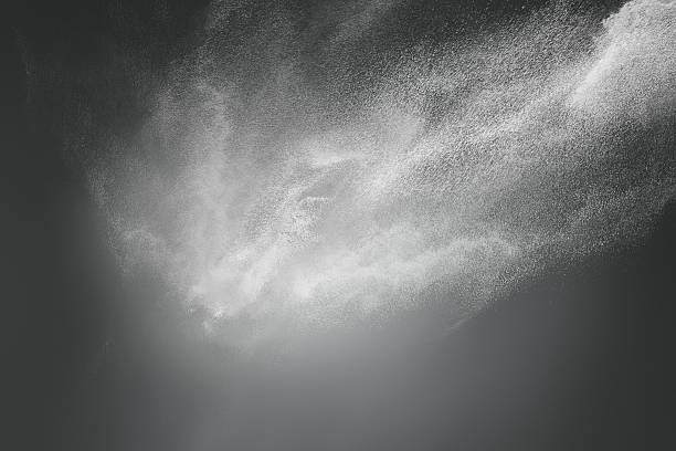 istock Abstract design of white powder cloud on dark background 186164353