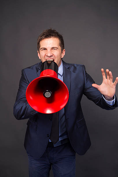 istock Businessman shouting in a megaphone. 186164910