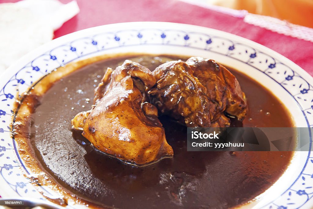 Chicken in brown sauce Chicken in mole sauce Chocolate Stock Photo