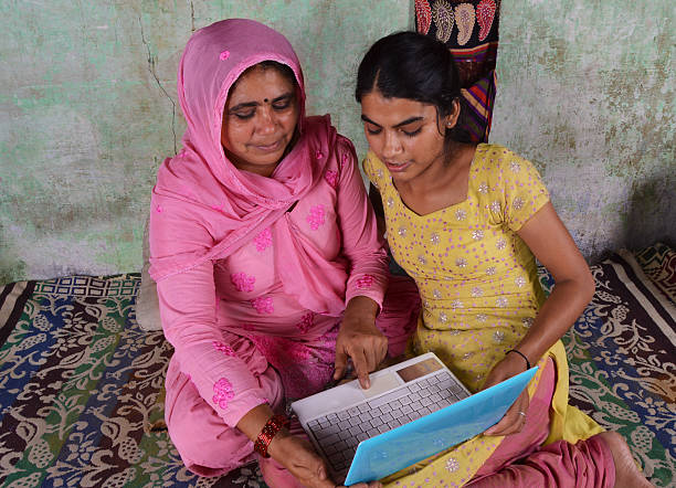 istock Indian Women Using Laptop with Her Daughter 186164954