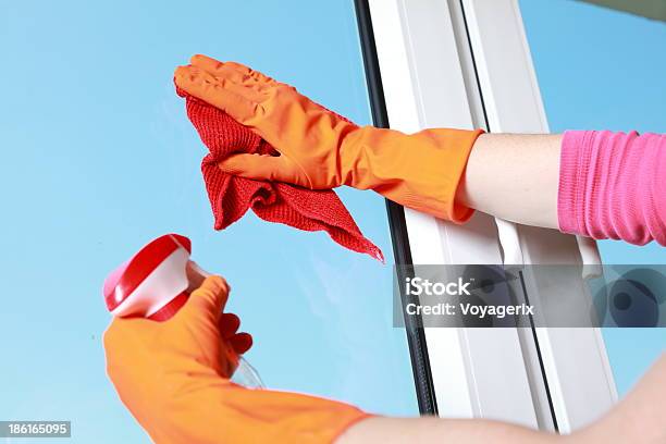 Gloved Hand Cleaning Window Rag And Spray Stock Photo - Download Image Now - Adult, Chores, Cleaner
