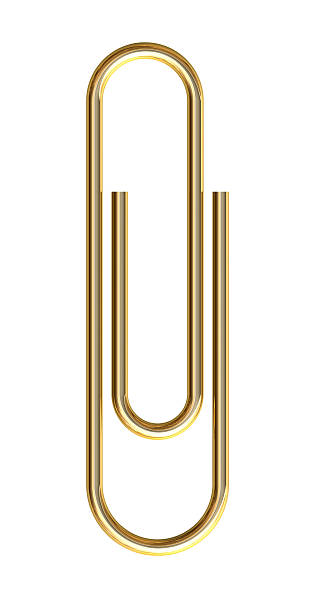 Gold paper clip Gold paper clip on white background paper clip stock pictures, royalty-free photos & images