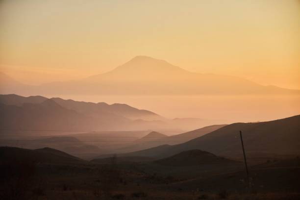 istock Mountain landscape. Towering Mount Ararat over the valley at sunset 1861655909