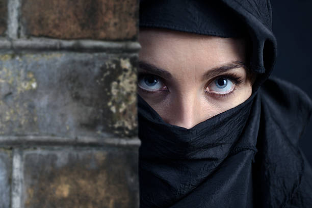 istock woman in  black 186168745