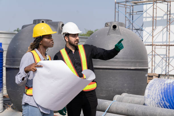 istock Male, female engineer worker working at construction site and installation sewer pipes. Group of construction supervisor working at construction site 1861692637