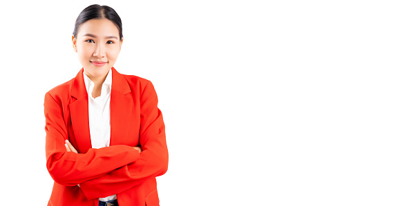 Smiling young asian Business woman crossed arms Happy asia girl posing crossed arms and looking at camera isolated on white background and copy space Confident lady get happy She wear red suit