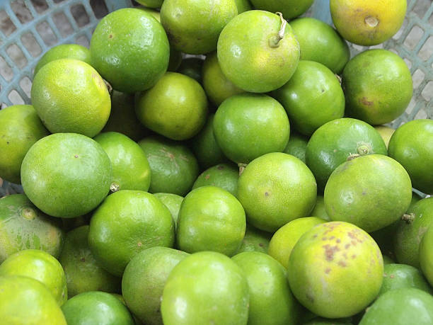 istock Fresh and green lemons background 186172249