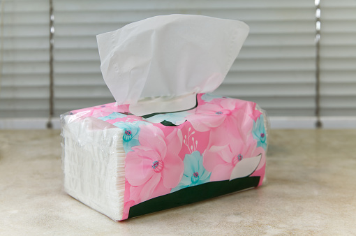Wrapped plastic with floral pattern Tissue mock up white tissue and no text for packaging on a marble table