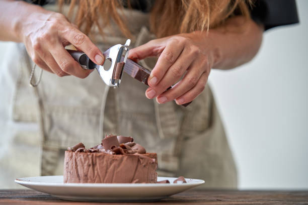 istock Chef decorating chocolate cake with shavings 1861725858