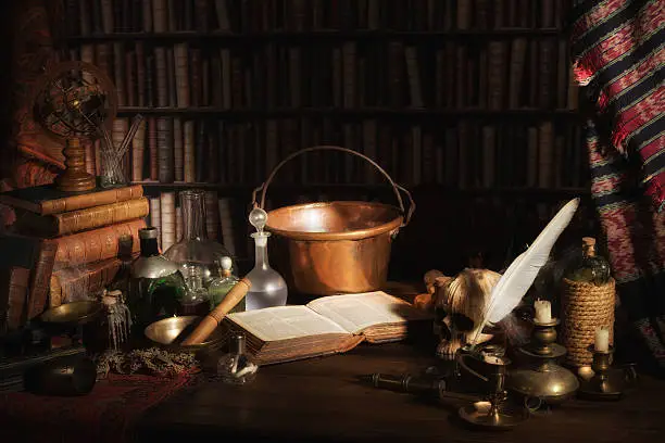 Halloween scene of a medieval alchemist kitchen or laboratory