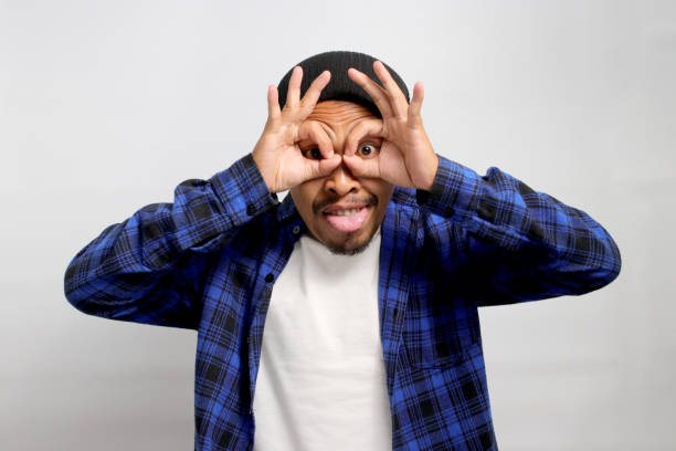 istock Asian man is making an OK gesture like binoculars 1861758007