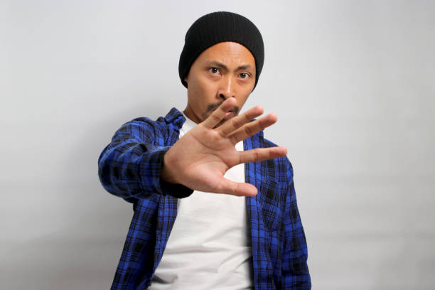 istock Asian man is making a firm STOP gesture 1861760137