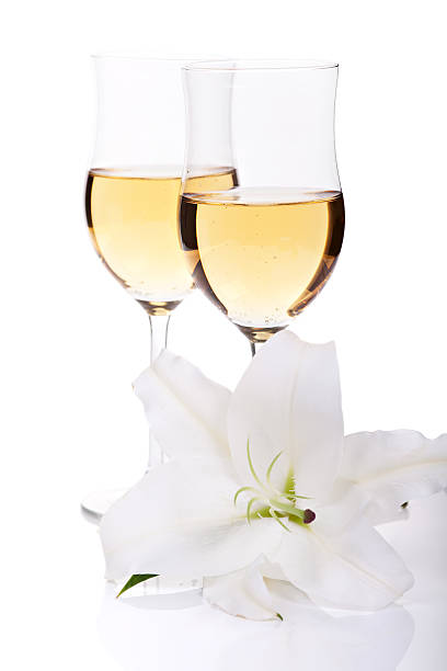 istock Flower of lilly and two champagne glasses 186178821