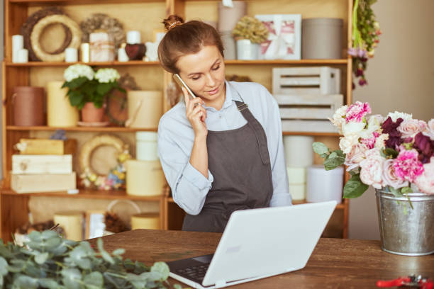 istock Self employed florist working at flower shop 1861810022