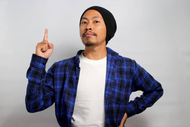 istock Asian man raising his finger in a eureka sign 1861810962