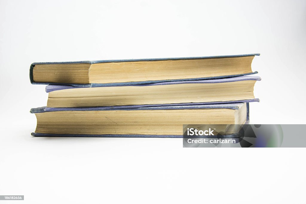Tres viejos libros - Foto de stock de Apilar libre de derechos