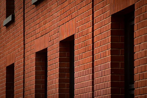 An abstract image or background of a building exterior made of red bricks