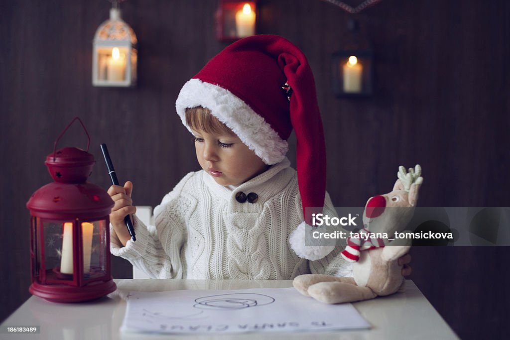 Boy, writing to Santa Anticipation Stock Photo