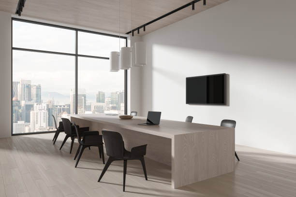 istock Cozy conference interior with table and chairs, tv screen and panoramic window 1861843239