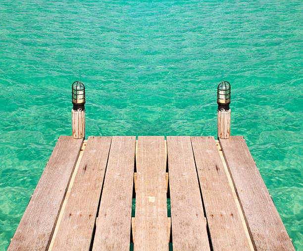 istock Wooden pier in turquoise sea 186185528