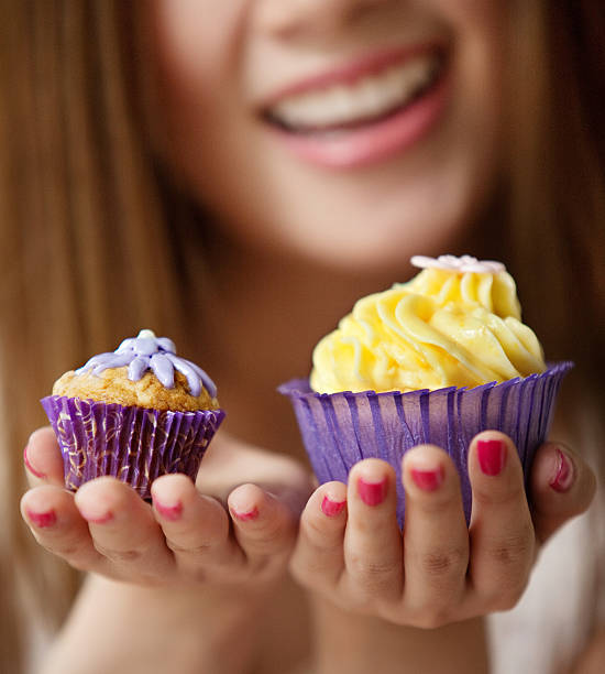 istock Woman holding a cup cake 186185561
