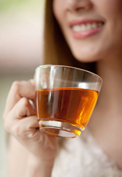 istock Woman holding a cup of tea 186185568