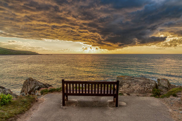 Sunset with dramatic clouds near Porthmeor Beach in St Ives, Cornwall, England, UK
