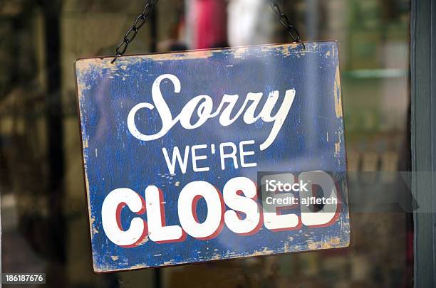 Old Blue Closed Sign Hanging In A Shop Window Stock Photo - Download Image Now - Closed Sign, Closed, Sadness