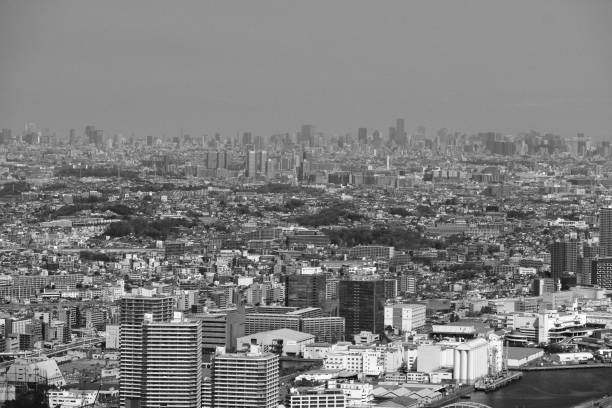 View from top of the Yokohama Landmark Tower of the sprawling Greater Tokyo Area with Tokyo skyline in the distance, the most populous metropolitan area in the world, consisting of the Kantō region of Japan as well as the prefecture of Yamanashi of the neighboring Chūbu region.