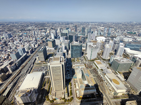 View from top of the Yokohama Landmark Tower, height 296.3 mt, of the city of Yokohama, the capital city and the most populous city in Kanagawa Prefecture, with a 2020 population of 3.8 million. It lies on Tokyo Bay, and is a commercial hub of the Greater Tokyo Area.