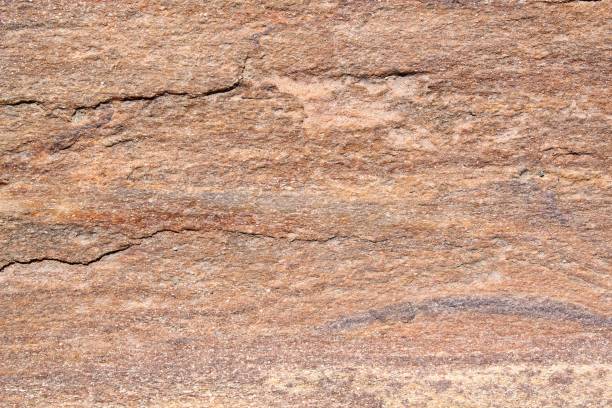 Mountain rock texture. Natural brown slate granite slab marble stone ceramic seamless tile rough surface background. Architecture grunge modern abstract style element. Close-up, copy space
