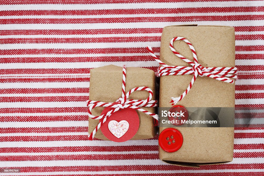 Handmade craft gift boxes Handmade craft gift boxes on striped cloth Close-up Stock Photo