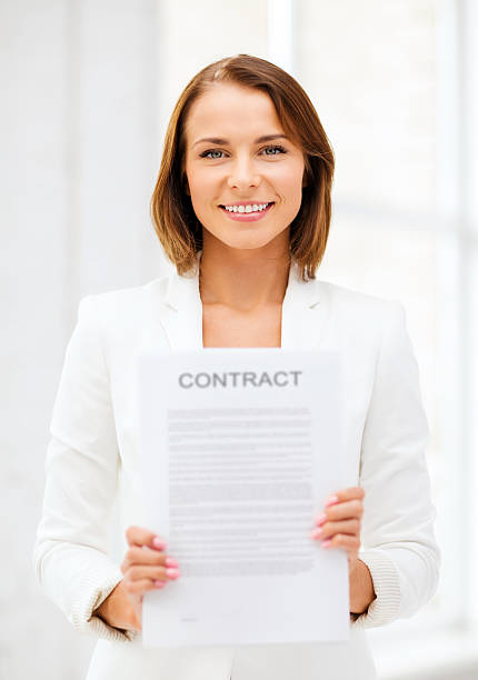 istock businesswoman holding contract 186204536