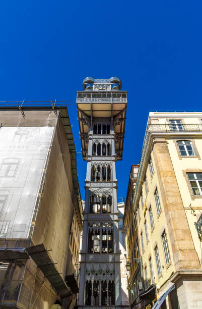 istock Frontal view from below of the Santa Justa Elevator or Elevador do Carmo. Modernist style metal structure elevator in the center of Lisbon. Portugal.Tourists taking photographs from the viewpoint. 1862053357