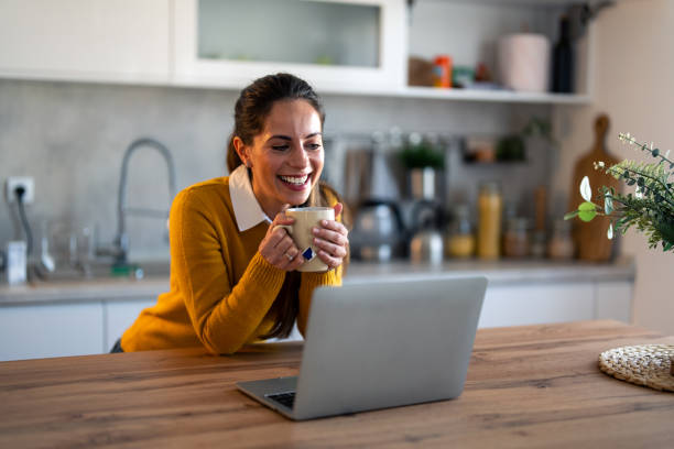 istock Smiling businesswoman having tea while on video call 1862065042