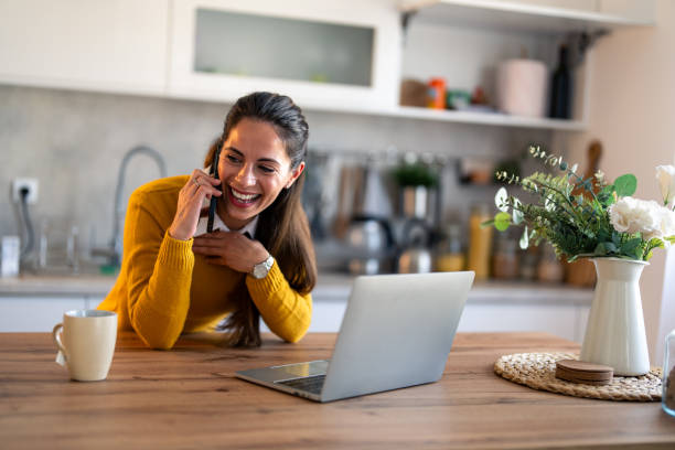 istock Happy smiling woman having fun conversation over mobile phone 1862067197