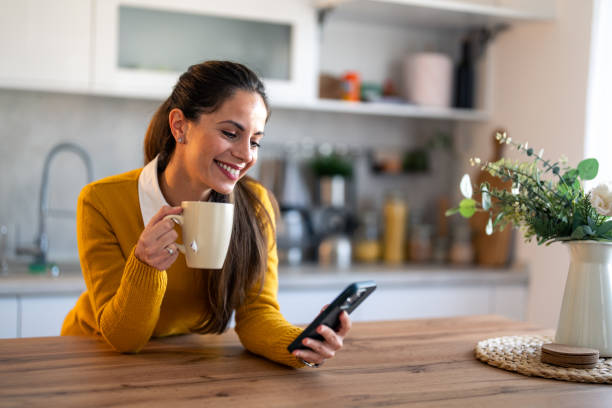 istock Focused businesswoman holding coffee cup and reading e-mails 1862068858