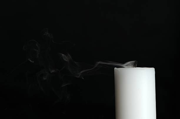 istock Smoke Coming from Candle on Black Background with Copy Space 186209666