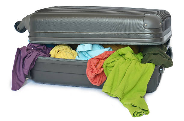 istock Suitcase with pile of shirts 186210083