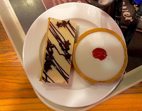 Two sweet cake desserts in a plate