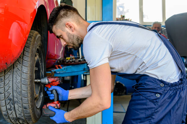 istock A Car Maintenance Man is Replacing a Car Tire in Auto Service. 1862105923