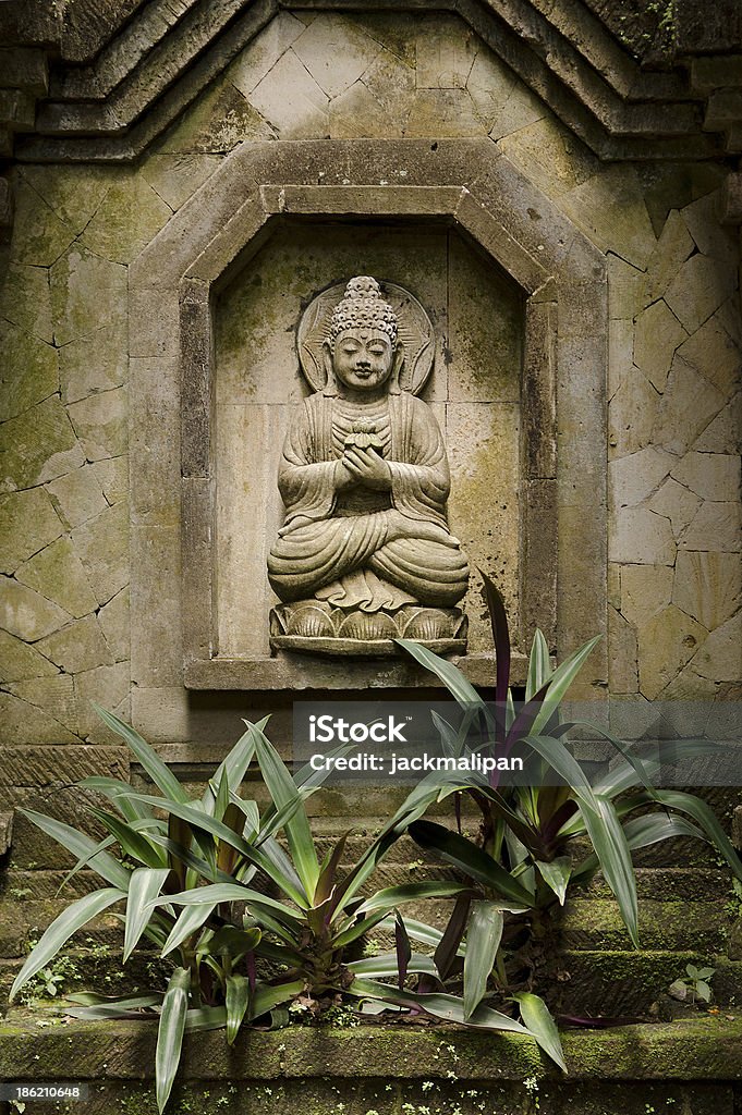 stone statue of buddha in bali indonesia old stone statue of buddha in bali indonesia Art Stock Photo